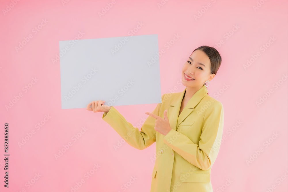 Portrait beautiful young asian business woman smile with empty white billboard Portrait beautiful young asian business woman smile with empty white billboard