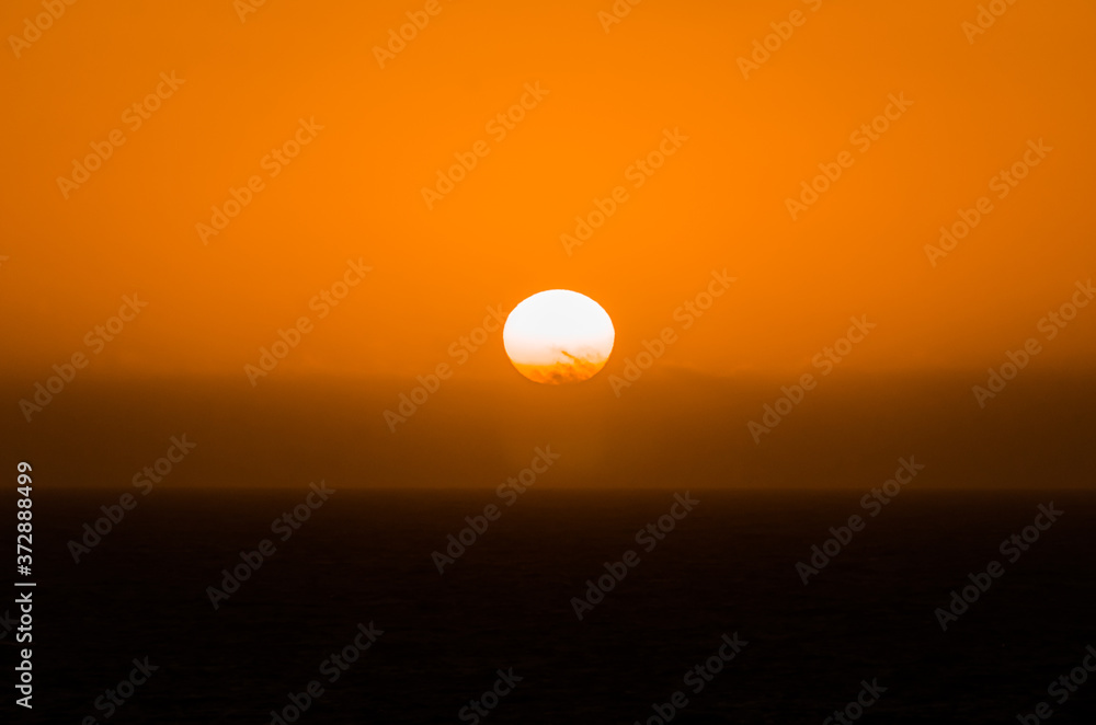 nature poster. orange sunset at the ocean