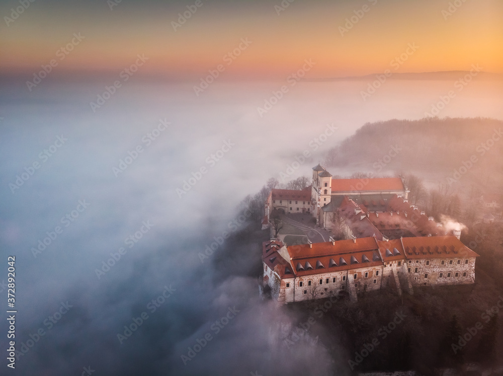 Fototapeta premium Drone aerial photo of Tyniec Abbey in mist near Krakow in Malopolska, Poland 