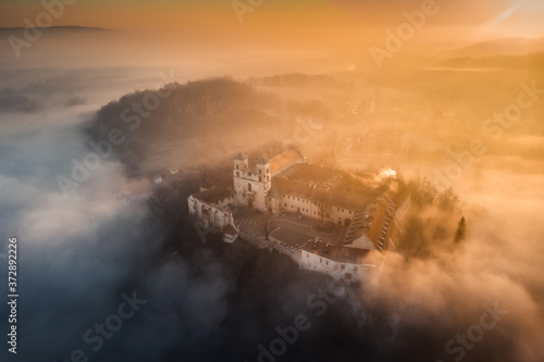 Drone aerial photo of Tyniec Abbey in mist near Krakow in Malopolska, Poland 