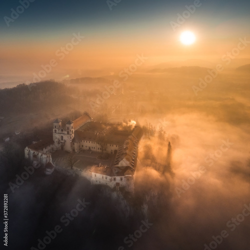 Drone aerial photo of Tyniec Abbey in mist near Krakow in Malopolska  Poland 