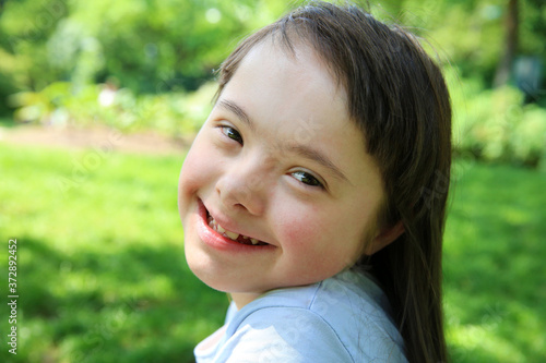 Portrait of little girl smiling in the park