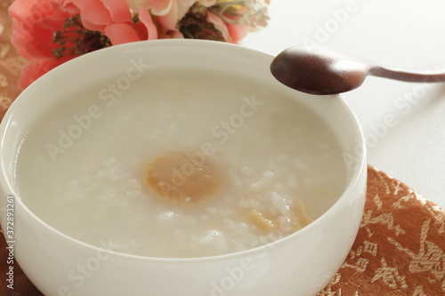 Chinese food, dried scallop in rice porridge for healthy gourmet congee photo