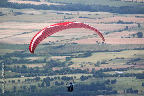 Paraglider flying from Dobrostan in Bulgaria photo