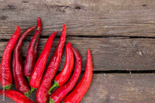red hot pepper on wooden background