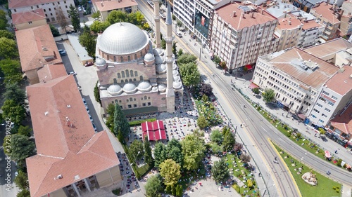 Aerial view of the big city Mosque near the tramway. People are at the garden for Friday Pray and they keep the distance. 