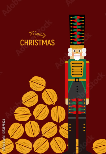 Christmas greeting card with nutcracker and golden nuts