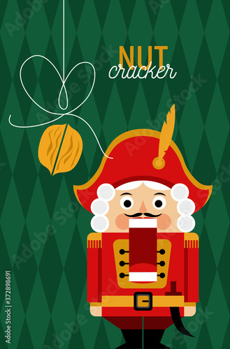 Christmas greeting card with nutcracker and nut