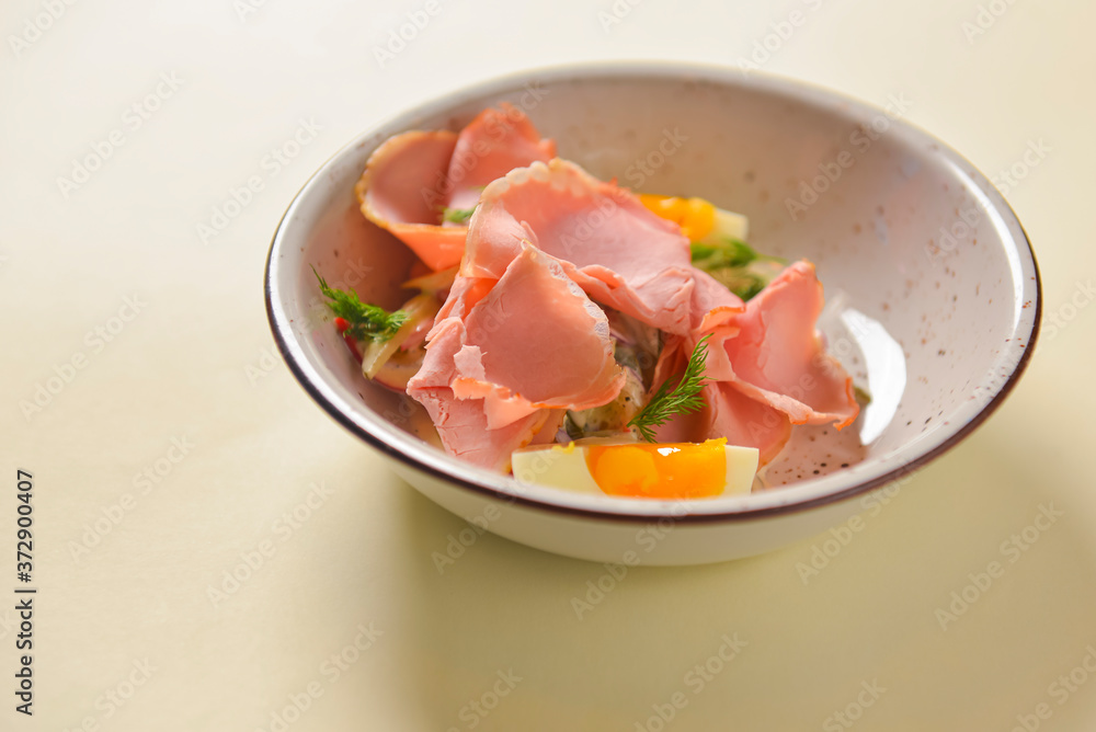 Boiled eggs with smoked ham and vegetables. Healthy vegetarian diet. Veggies salad. Boiled eggs with smoked ham and vegetables. Healthy vegetarian diet. Veggies salad.