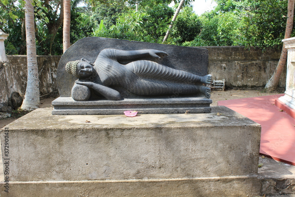 Buddhist sculpture of a lying woman