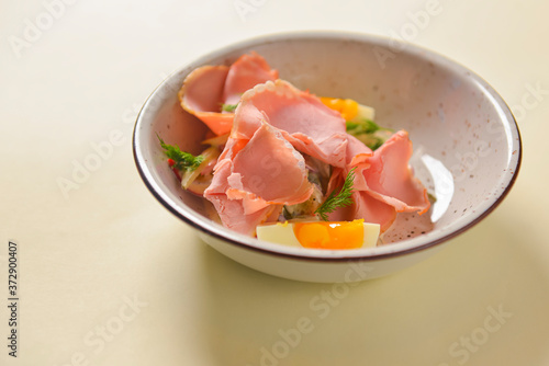 Boiled eggs with smoked ham and vegetables. Healthy vegetarian diet. Veggies salad.