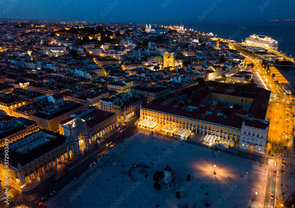Aerial night view of Lisbon city center with embankment, Portugal