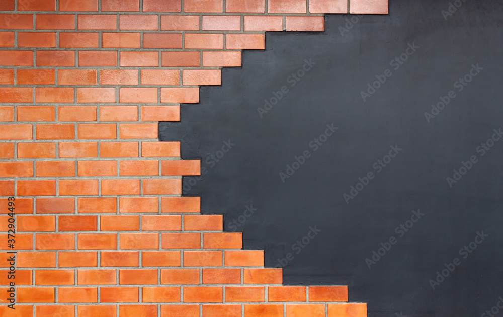 Obraz premium Brick wall background texture of stained old dark brown and red brick with light on black wall.