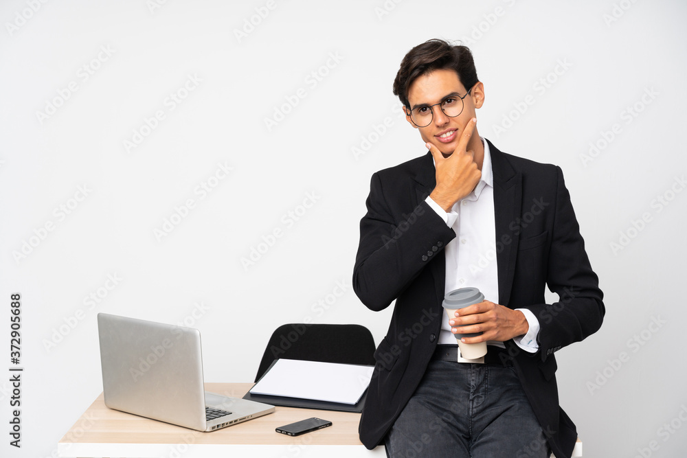 Businessman in his office over isolated white background thinking an idea Businessman in his office over isolated white background thinking an idea