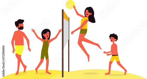A happy family playing volleyball together during holiday at the beach