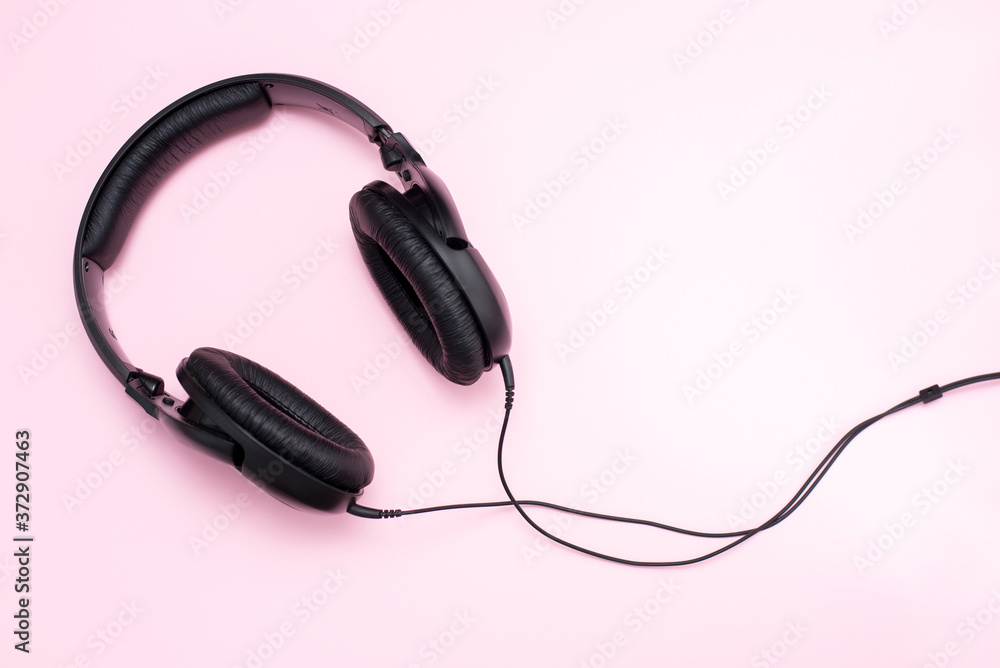black Headphones on a pink Background black Headphones on a pink Background