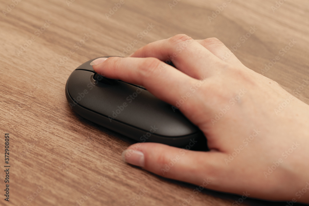 Business, Education, Programming, People and Technology Concept.. Woman hand on computer keyboard wireless mouse.close up. Business, Education, Programming, People and Technology Concept.. Woman hand on computer keyboard wireless mouse.close up.
