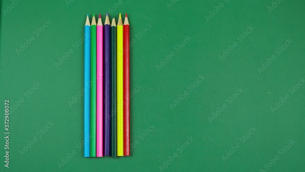 Colored pencils animation 4K screen movement on a green background ...