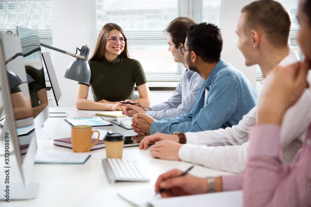 Multy-ethnic group of business people working at office Multy-ethnic group of business people working at office