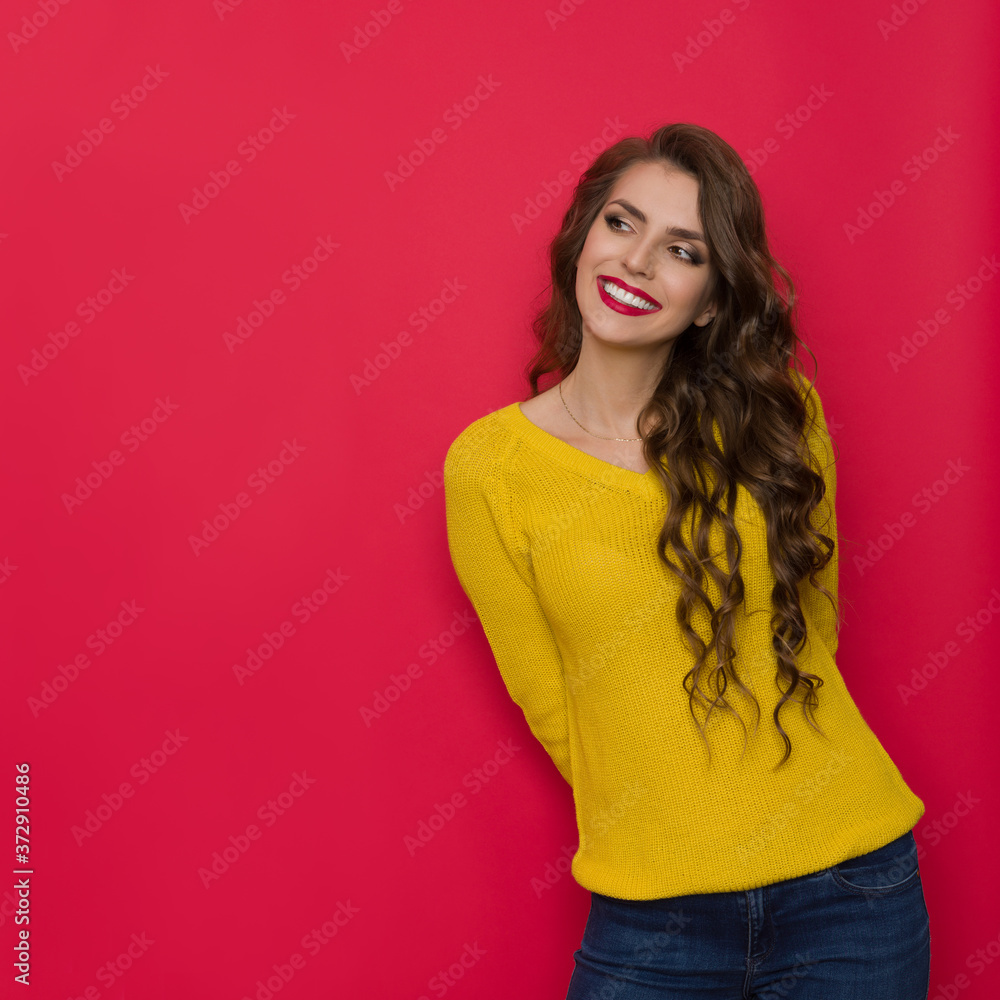 Smiling Young Woman In Yellow Sweater Looks Aside Smiling Young Woman In Yellow Sweater Looks Aside