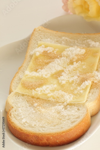 sliced cheese and sugar on toast for asian broakfast