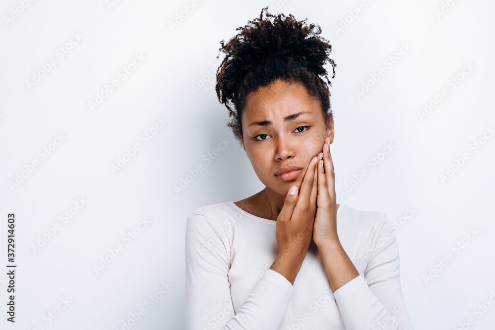 Young girl over isolated white background with toothache Young girl over isolated white background with toothache