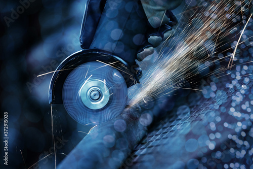 Angle grinder cutting steel