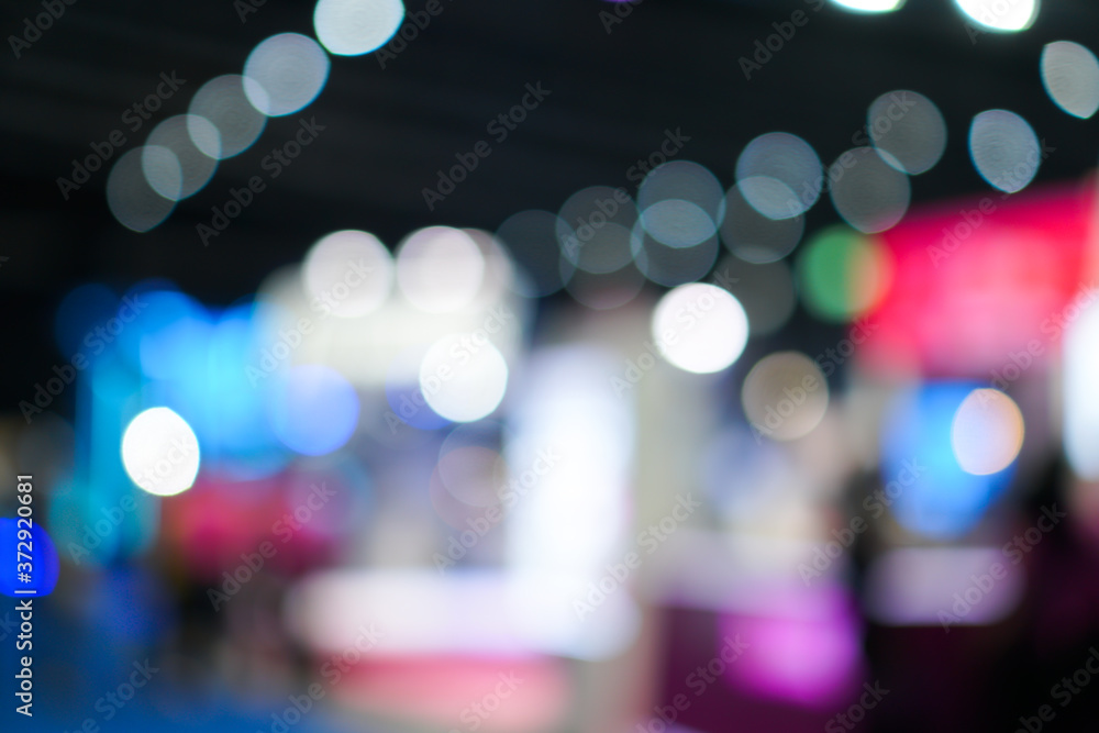 Light Bokeh Event exhibition business concept; Abstract blurred of defocused convention exhibit trade show and booth in conference hall background. backdrop with glitter sparkle blurred circles