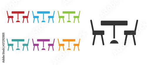 Black Picnic table with chairs on either side of the table icon isolated on white background. Set icons colorful. Vector.