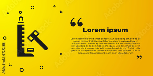 Black High striker attraction with big hammer icon isolated on yellow background. Attraction for measuring strength. Amusement park. Vector.