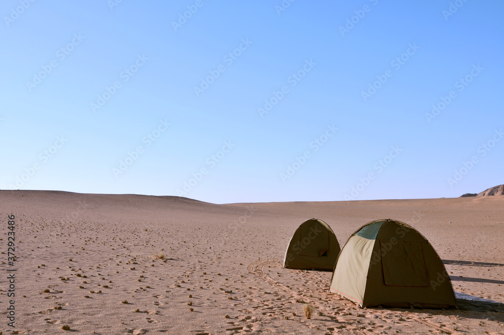 Two tents in what looks like no-mans-land in the middle of the Namib Desert