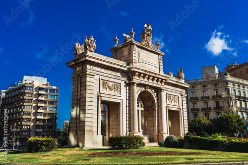 Porta del Mar, a square in the center of Valencia with a large stone construction, with saturated colors.