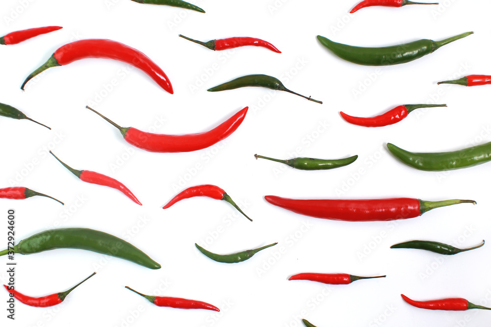 Green And Red Chilies Arranged Over White Background Green And Red Chilies Arranged Over White Background