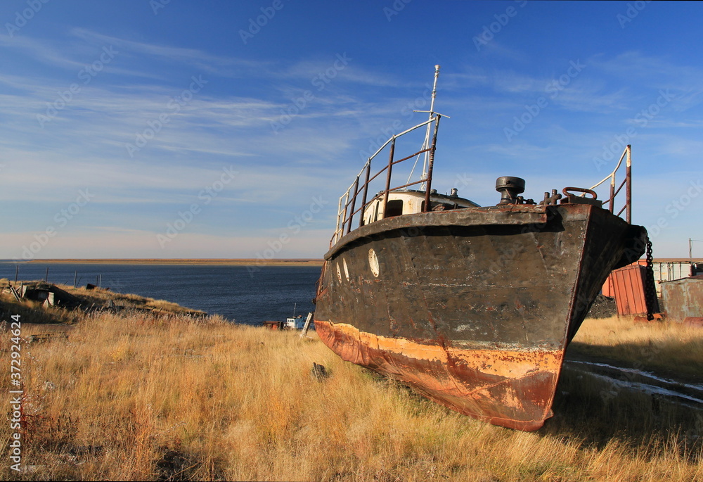 Old ship. Northern river Khatanga. Siberia. Krasnoyarsk region. Old ship. Northern river Khatanga. Siberia. Krasnoyarsk region.