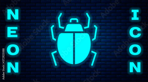 Glowing neon Mite icon isolated on brick wall background. Vector.