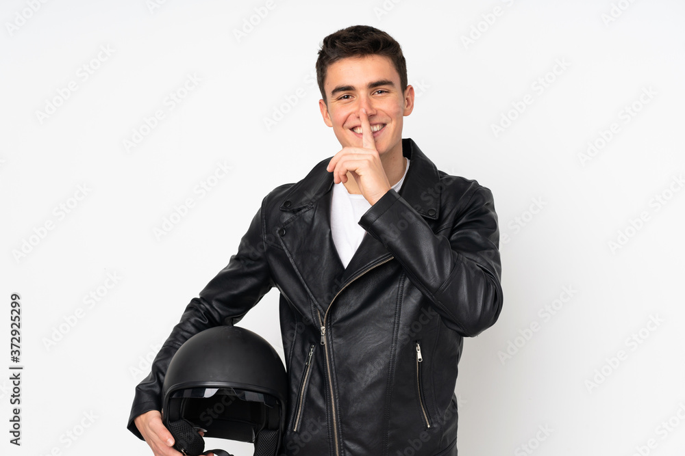 Man holding a motorcycle helmet isolated on white background doing silence gesture Man holding a motorcycle helmet isolated on white background doing silence gesture