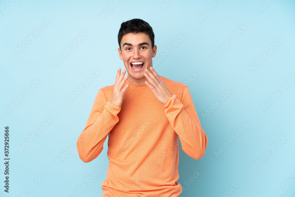 Teenager caucasian handsome man isolated on purple background with surprise facial expression Teenager caucasian handsome man isolated on purple background with surprise facial expression