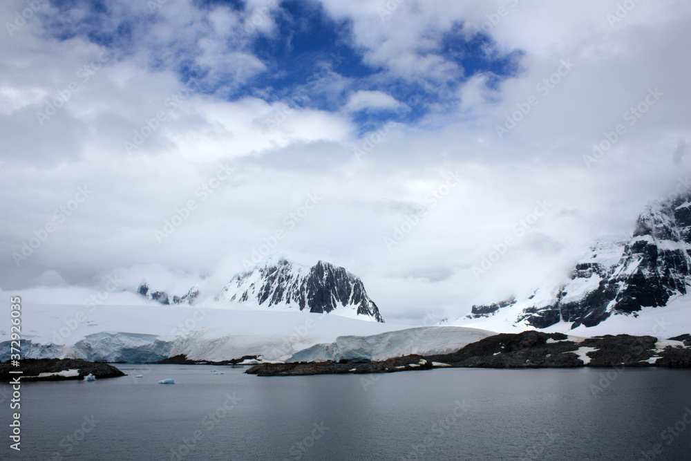 Mountain with huge glacier edge near Port Lockroy in the Neumayer Canal, Antarctica