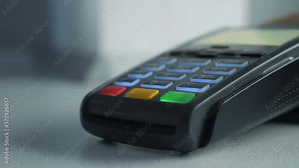 Payment by credit card, purchase and sale of goods and services. Credit card in the store. girl pays the card reader lifestyle online shopping concept Payment by credit card, purchase and sale of goods and services. Credit card in the store. girl pays the card reader lifestyle online shopping concept