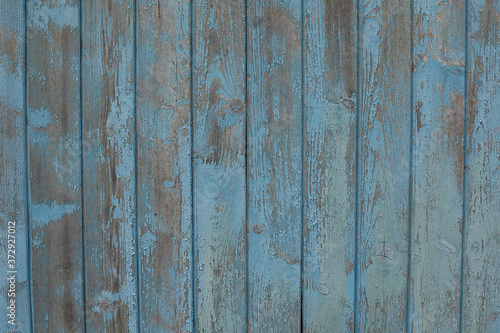 Vintage wood background with peeling paint. Blue background