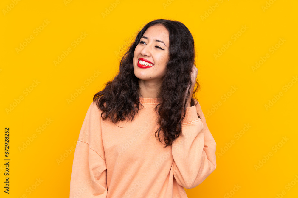 Spanish Chinese woman over isolated yellow background thinking an idea Spanish Chinese woman over isolated yellow background thinking an idea