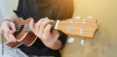 Girl playing ukulele