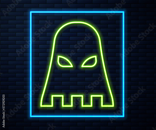 Glowing neon line Executioner mask icon isolated on brick wall background. Hangman, torturer, executor, tormentor, butcher, headsman icon. Vector.