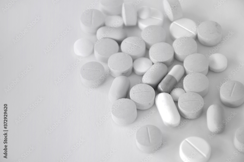 white pills on white background white pills on white background