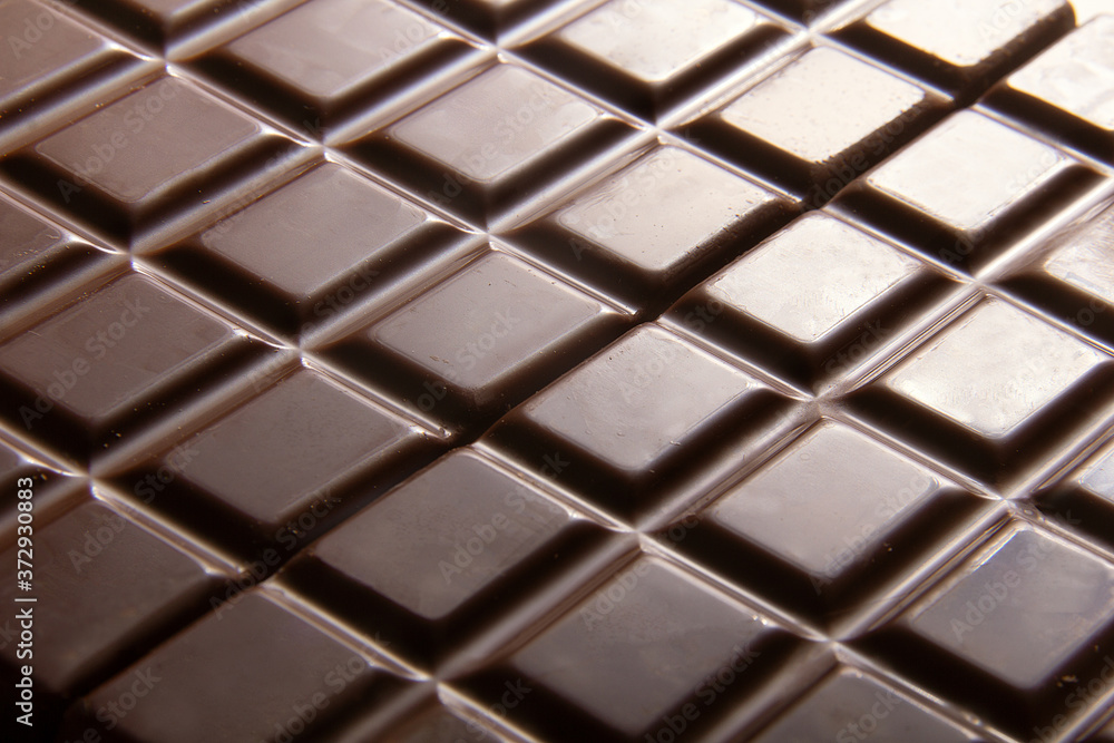 Pure chocolate bars, looking especially delicious. they are squared blocks shaped Pure chocolate bars, looking especially delicious. they are squared blocks shaped