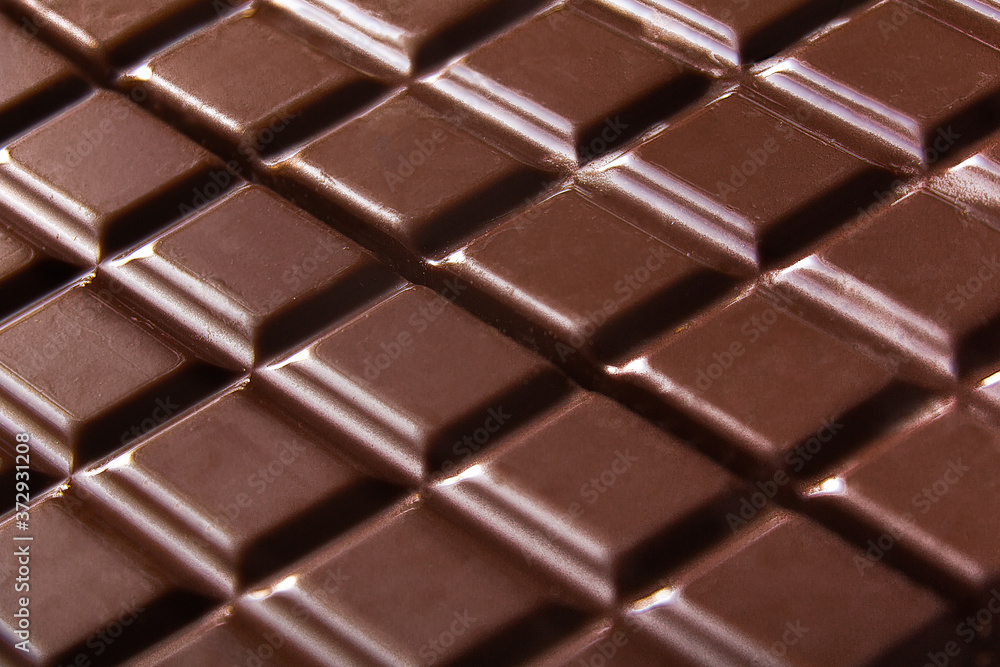 Pure chocolate bars, looking especially delicious. they are squared blocks shaped
