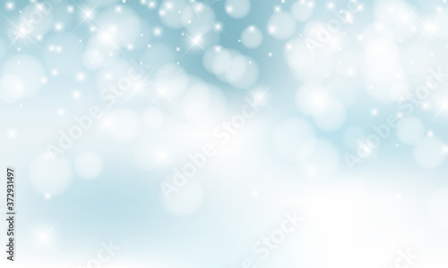 Christmas background with blur golden lights with snowflakes. © TripleP Studio