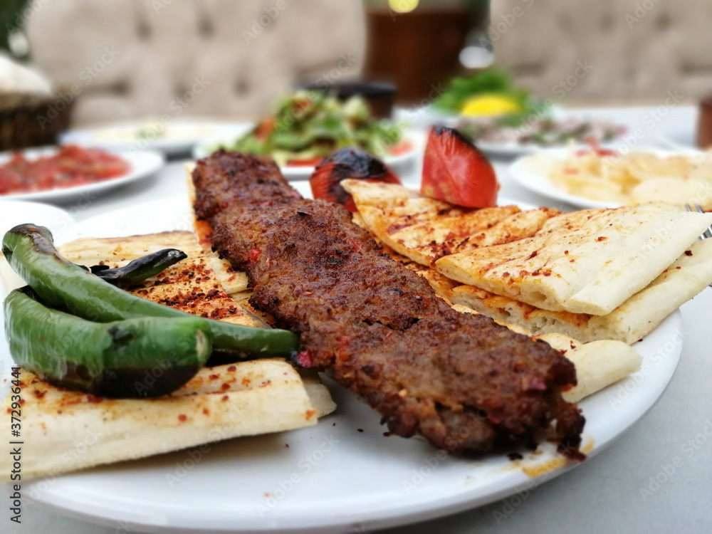 delicious Adana kebab and salads delicious Adana kebab and salads