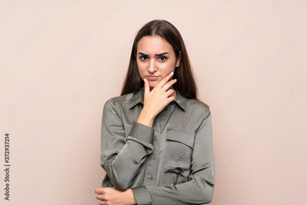 Young girl over isolated background thinking Young girl over isolated background thinking