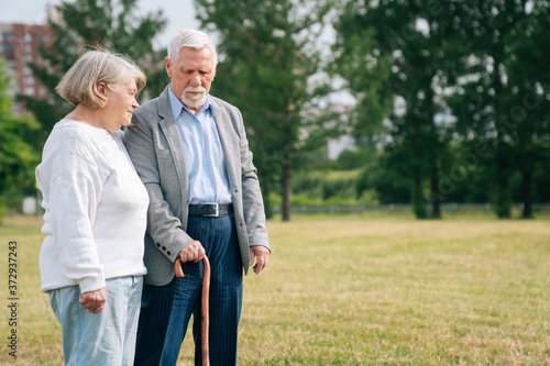 Elderly retired people walk in the fresh air. The concept of disease prevention. Older married couple